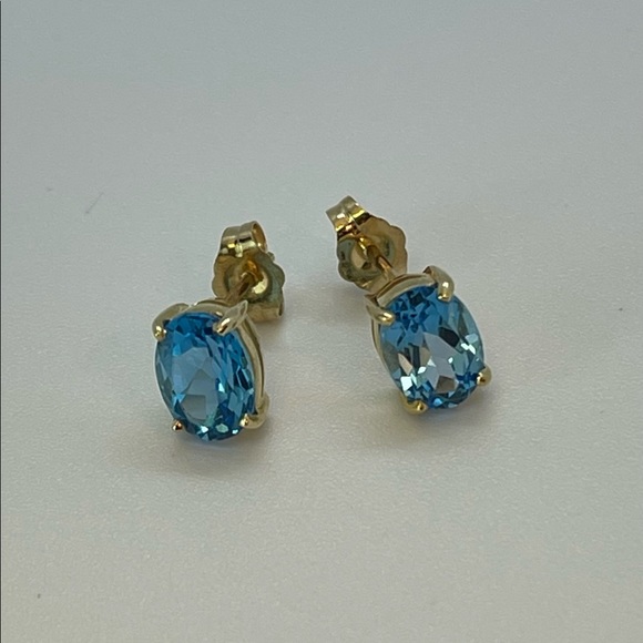 Solid 14K Yellow Gold Oval Swiss Blue Topaz Stud Earrings - Picture 4 of 4